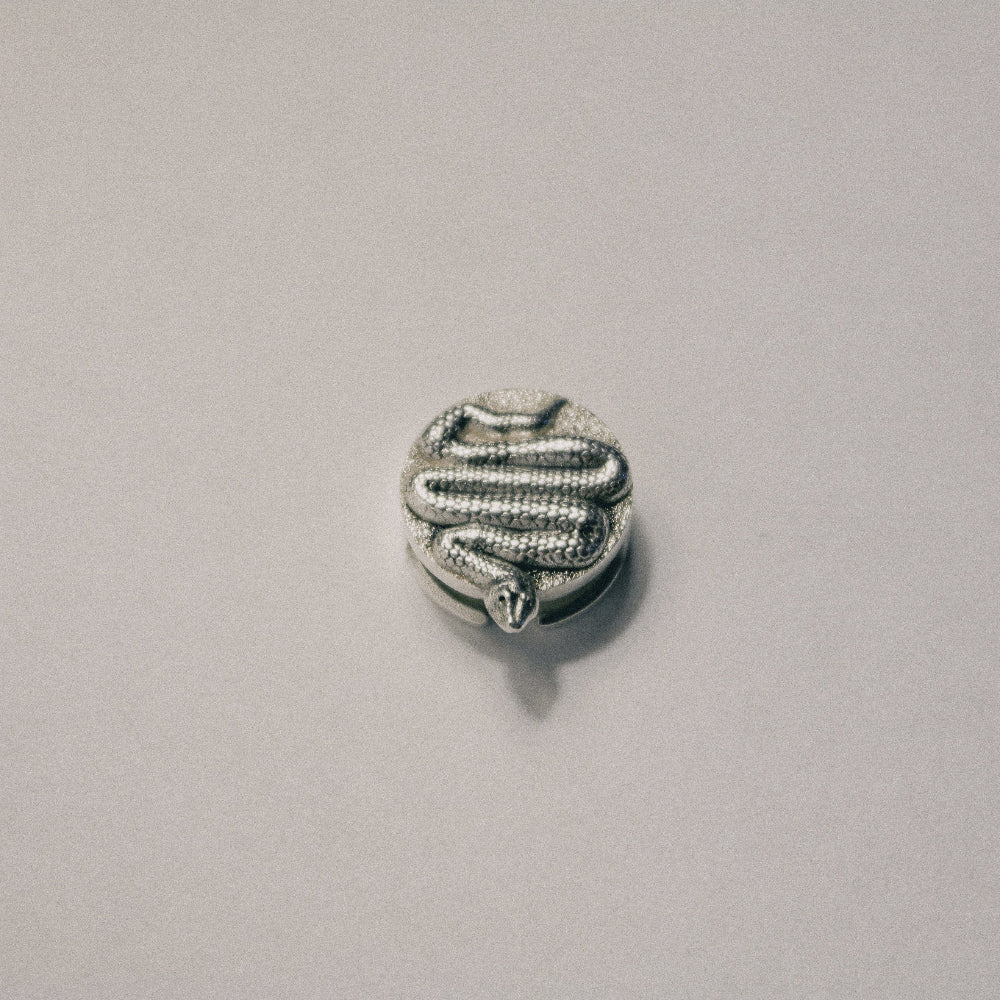The Serpent button
