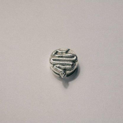 The Serpent button