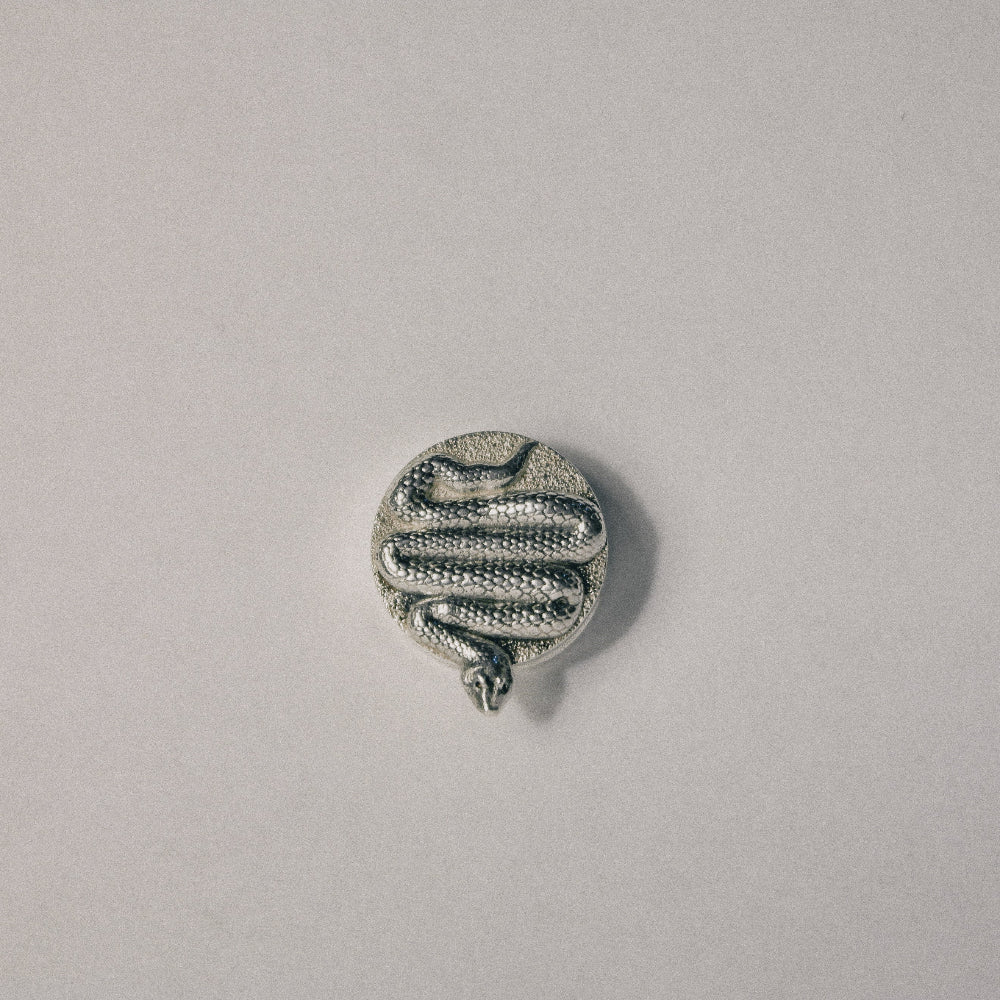The Serpent button