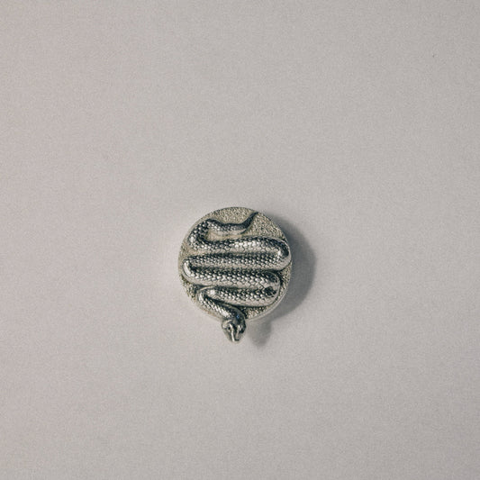 The Serpent button